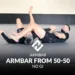 Learn Jiu-Jitsu online at HybridJJ: A practitioner executing an innovative armbar from the 50-50 guard in a no-gi setting, showcasing a technique to surprise opponents.